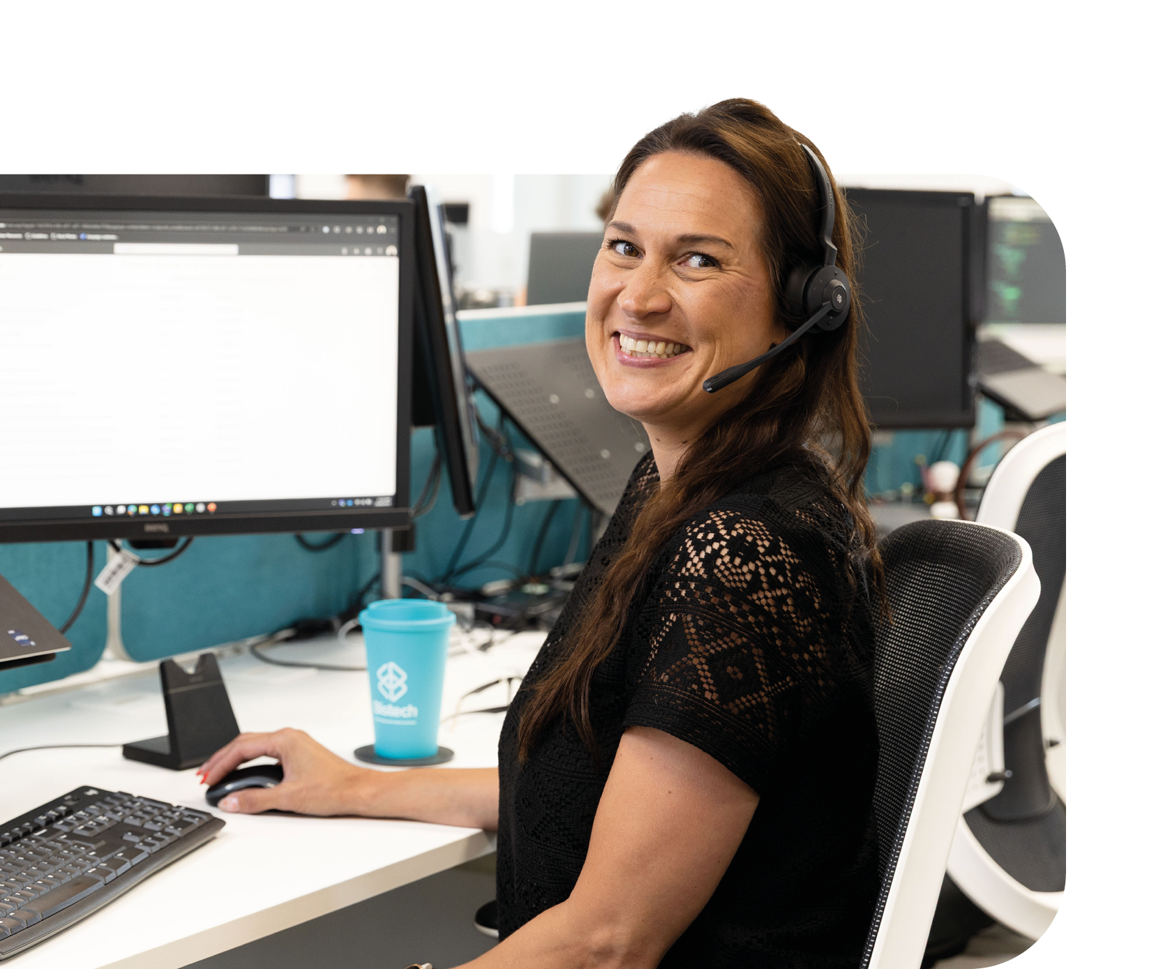 lady smiling at desk